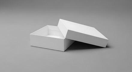 Open white cardboard box with lid slightly ajar on a gray background
