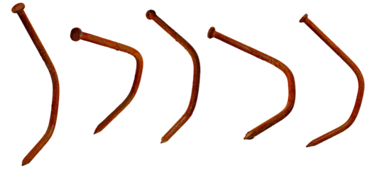 Isolated collection of rusty bent carpenter's nails on white background