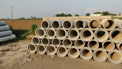 Industrial development pipes arranged neatly outdoors symbolizing progress construction and...