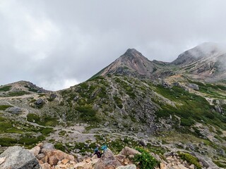summit of Mt. Hakusan is an interesting sight with scattered crater lakes, flowers, and rocks, in Hakusan City, Ishikawa Prefecture, Japan in July 