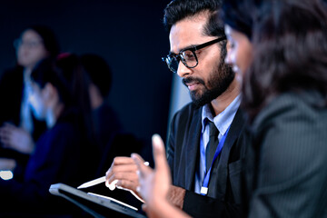 Code deep dive briefing. Experienced male developer explains software architecture or complex...