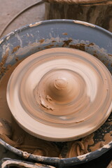 Close-up of a rotating disc used to make ceramic clay