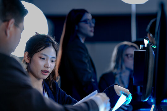 Building tomorrow AI tonight deep focus diverse engineers code train complex models multi screen setup innovation lab intense collaboration future tech taking shape now project crunch.
