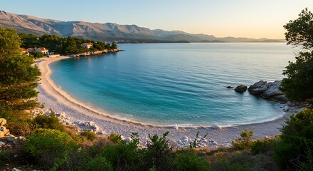 Scenic coastal bay with turquoise water and sandy beach under the sky.