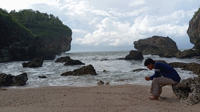 waves on the coral rocks in the beach with white sand - Powered by Adobe