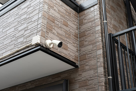 A CCTV camera that installed on apartment balcony for security monitoring. Technology for safety living in city life. 