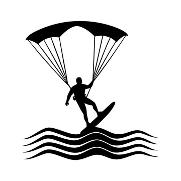 Silhouette of a kitesurfer riding a wave with a parachute