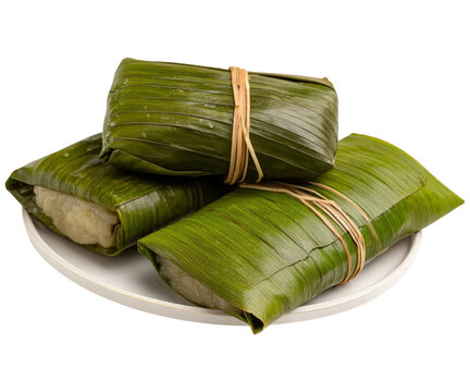 Delicious steamed kuih lepat pisang wrapped in banana leaves traditional southeast asian dessert