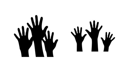 Fototapeta premium Silhouette of multiple raised hands waving in a group symbolizing unity and participation