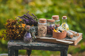Dried medicinal herbs on the table. Selective focus.