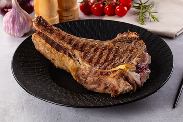 Grilled ribeye beef steak with bone