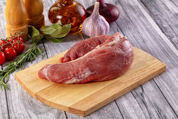 Raw pork sirloing over board