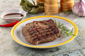 Grilled juicy beef steak with pepper