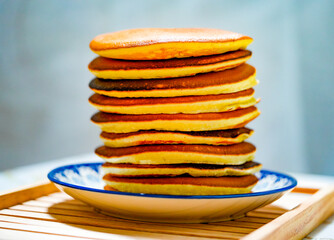 Freshly tasty stack of pancakes on the plate. Delicious homemade breakfast