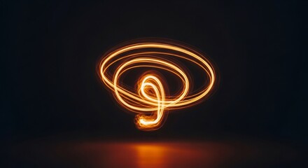 Dynamic light painting with swirling golden trails on dark backdrop offering a modern abstract feel for technology, innovation, and creative projects