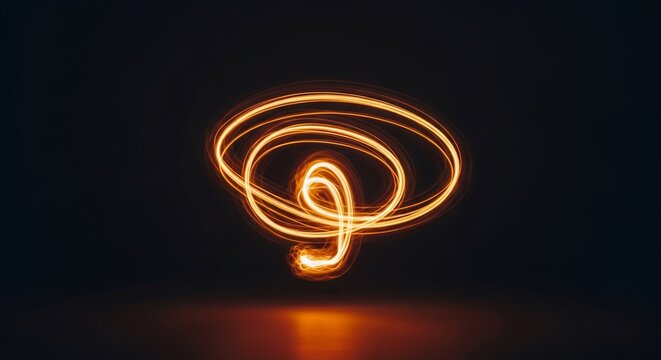 Dynamic light painting with swirling golden trails on dark backdrop offering a modern abstract feel for technology, innovation, and creative projects