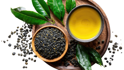 Dried tea leaves, vibrant green tea leaves, and golden tea in a bowl