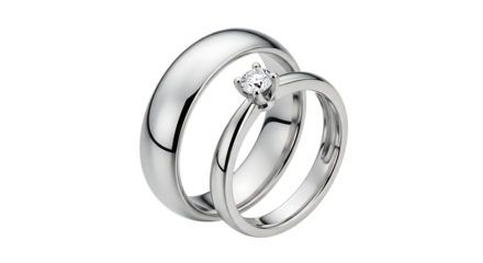 Two elegant white gold wedding rings with diamond engagement ring