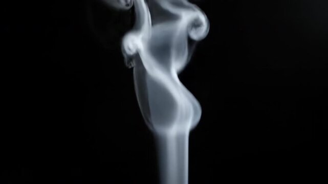 Wisps of white smoke plumes rising gracefully in slow motion, forming beautiful, ethereal, organic patterns vapor, motion, spirit