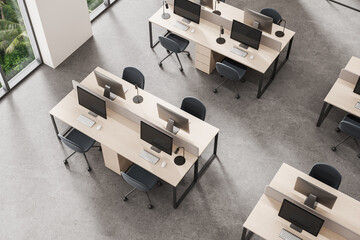 Top view of modern office interior with workstations, sleek desks, ergonomic chairs, and large windows in minimal design concept environment. 3D Rendering