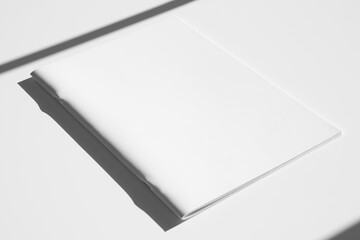 A4 portrait magazine, catalog cover mockup, saddle stitch, hard shadows