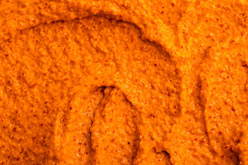 Orange yogurt ice cream with fresh fruits and berries, papaya, grapefruit, pumpkin, persimmon. Smoothie texture. Fruit yogurt ice cream. Delicious sweet dessert close-up as a background.