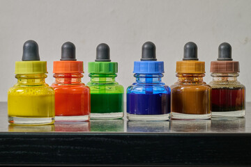 watercolor paint pot on wooden plank