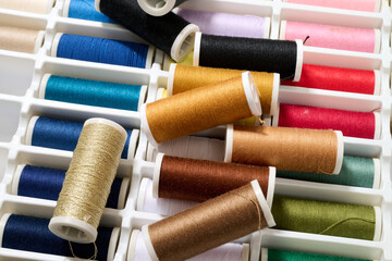 spools of multicolored sewing thread