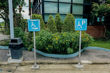 A disable ramp and disable parking signage in front of a car parking lot