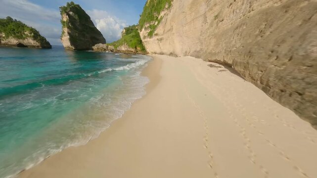FPV drone flight over a secluded tropical beach in Bli.
