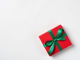 Red gift box with green ribbon for christmas celebrating