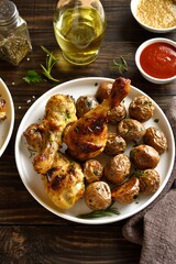 Grilled chicken drumsticks with roasted potatoes