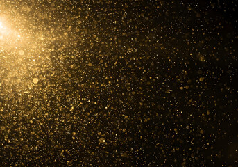Fototapeta premium Golden Dust Particles Illuminated by Light image photo