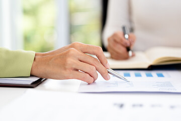 close up hands of Business partners working with analysis report and advisor showing plan, Two...