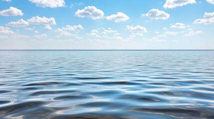 Obraz premium Calm water reflects clouds under bright blue sky, creating serene atmosphere