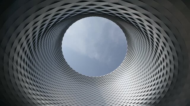 Basel, Switzerland &mdash; Contemporary architecture of Messe Basel, the city&rsquo;s modern expo and trade fair complex, showcasing its iconic circular opening and aluminum facade
