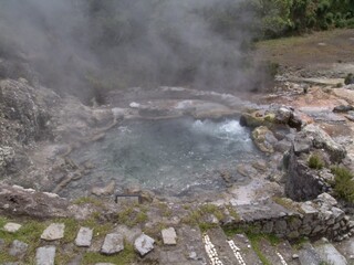 Steam rising from Caldeira Velha hot spring, Azores