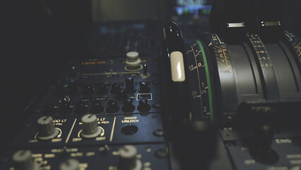 Detailed view of airplane cockpit throttle and control switches. Aviation technology and aircraft engineering concept for transport industry.