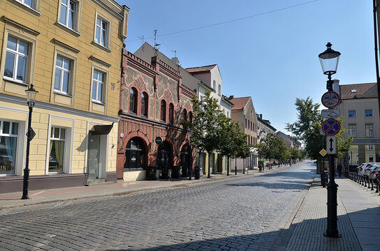 Klaipeda, Lithuania - September 08, 2025: Cobblestone Charm: Klaipėda Old Town Street on a Bright Summer Day