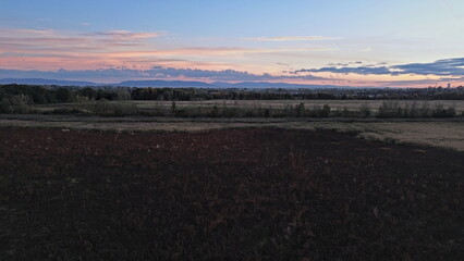 Drone landscape of dry lakebed and countryside at sunset