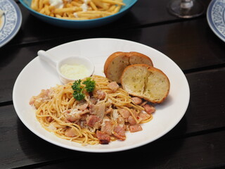 Spaghetti Aglio e Olio Served with Garlic Bread and Parsley at Hotel Buffet in Phuket, Bangkok
