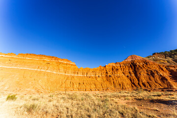 Stunning View of Palo Duro Canyon in Texas with Red Rock Formations Under a Clear Blue Sky