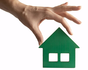 Picking the perfect green home, symbolizing eco friendly living and sustainable choices for a brighter future