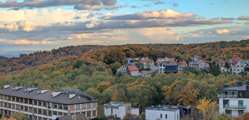 Autumn panorama of the outskirts of the city at sunset