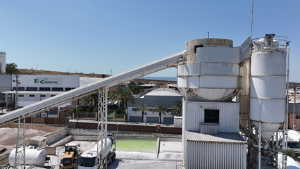 Aerial drone view of industrial cement plant and construction materials factory