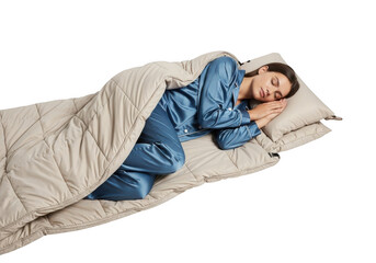 A woman in blue pajamas sleeping peacefully in a sleeping bag isolated on transparent background