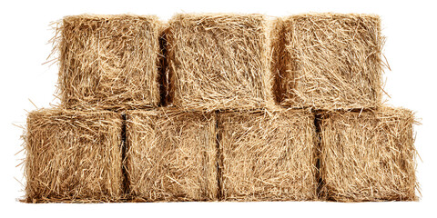 Stacked rectangular bales of dried straw or hay against a black background