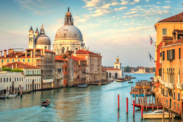 Naklejka premium Grand canal in venice with domed cathedrals and colorful buildings