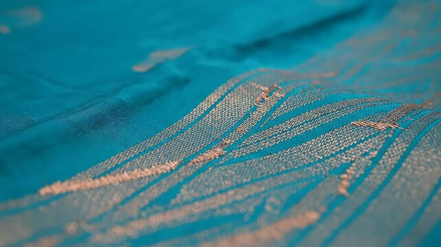 Elegant turquoise vaira oosi silk saree fabric showcasing its texture for promotion and advertising video