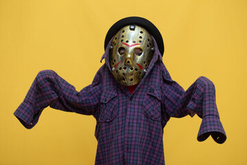 Spooky Halloween Fun: Child in Horror Mask and Scarecrow Costume